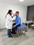 Latin woman doctor specialist ophthalmologist checks the eyes of her dark-skinned male patient suffering from an infection