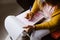 Latin woman hands writing and signing a document or a questionnaire in South America