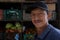 Latin worker men in street vending booth grocery market with vegetables and fruits in the street