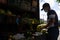 Latin worker men in street vending booth grocery market with vegetables and fruits in the street