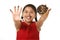 Latin young girl in red dress holding chocolate donut with hands and mouth stained and dirty showing smiling happy