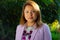 Latina Businesswoman in front of green background