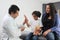 Latina mother cares for and accompanies her curly little daughter at the dark-haired pediatrician specialist doctor`s office to pr