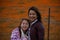 Latina Mother and Daughter in front of desert California Poppy field orange bokeh