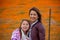 Latina Mother and Daughter in front of desert California Poppy field orange bokeh