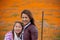 Latina Mother and Daughter in front of desert California Poppy field orange bokeh