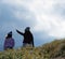 Latina Mother and Daughter walking in desert California Poppy field on path