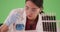 Latina scientist or medical researcher with blood samples on greenscreen