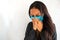 Latina traveler wears mask to protect from coronavirus, Latina woman wears face mask, respiratory protection