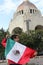 Latino adult man shows the flag of mexico proud of his country\'s culture and tradition, celebrates mexican patriotism