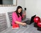 Latino adult woman working at home office in her dining room with laptop, glasses and notebook in the new normal due to the Covid-