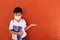 Latino boy with uniform shirt, mask, backpack, notebook and bottle of water back to school in the new normal due to the Coronaviru