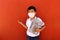 Latino boy with uniform shirt, mask, backpack, notebook and bottle of water back to school in the new normal due to the Coronaviru