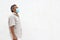 Latino elderly with protective face masks on white wall background, new normal covid-19