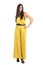 Latino fashion model in yellow evening jumpsuit posing to camera