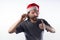 Latino man with Christmas hat with a candy cane