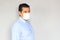 Latino man with clinical use mouth masks for protection from covid-19 virus