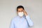Latino man with clinical use mouth masks for protection from covid-19 virus