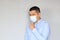 Latino man with clinical use mouth masks for protection from covid-19 virus