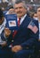 Latino man reading U.S. citizenship book