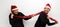 Latino man woman couple with Christmas hat and garland as scarf show their love and excitement for the arrival of December and cel