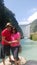 Latino man and woman couple visit the pier of the Tamul Waterfall, Cueva del Agua in Tamasopo San Luis Potosi Mexico on their vaca