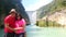 Latino man and woman couple visit the pier of the Tamul Waterfall, Cueva del Agua in Tamasopo San Luis Potosi Mexico on their vaca