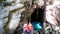 Latino man and woman couple visit the pier of the Tamul Waterfall, Cueva del Agua in Tamasopo San Luis Potosi Mexico on their vaca