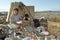 Latino mother and daughter work on garbage dump