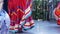 Latino women in colourful traditional dresses dancing Jarabe tapatio, mexican national folk hat dance. Street