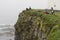 Latrabjarg bird cliffs, West Fjords, Iceland. Tourists taking pictures of bird life.