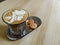 Latte Art Delight: Coffee and Biscuits Duo