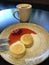 Latte with cinnamon and cheesecakes with strawberry jam