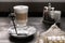 Latte macchiato, dark photo. Cozy coffee shop, selective focus