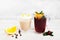 Latte and sangria glasses on white background