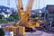 Lattice boom crane at construction site