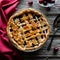 A lattice cherry pie on a rustic wooden board, ready for serving.