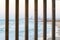 Lattice grid City buildings sea shore wooden fence view, sunset.