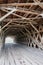 The lattice infrastructure of the iconic Hogback Covered Bridge spanning the North River, Winterset, Madison County, Iowa