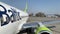 Latvia, Riga, 23 April 2019: Plane windows, without people, sunny spring weather, blue sky, Air Baltic logo, turbine