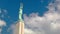 Latvian Freedom monument and clouds sliding over it