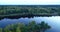 Latvian rural landscape with a winding river, forests and country roads, aerial top view. Daugava river