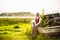 Latvian woman in traditional clothing on old boat.