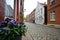 LAUENBURG, GERMANY, MAY 23, 2020: Old town alley with cobblestones, historic houses and a flowerpot in Lauenburg on the river Elbe