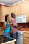 Laughing African American Couple Cooking-Vertical