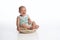 Laughing Baby Boy Sitting in a Rustic Bowl