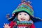 Laughing baby in funny knitted hat and scarf