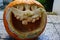 Laughing big mouth halloween jack-o-lantern made of carved pumpkin