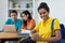 Laughing brazilian female students with group of computer science students