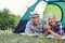 Laughing couple seniors on camping holiday